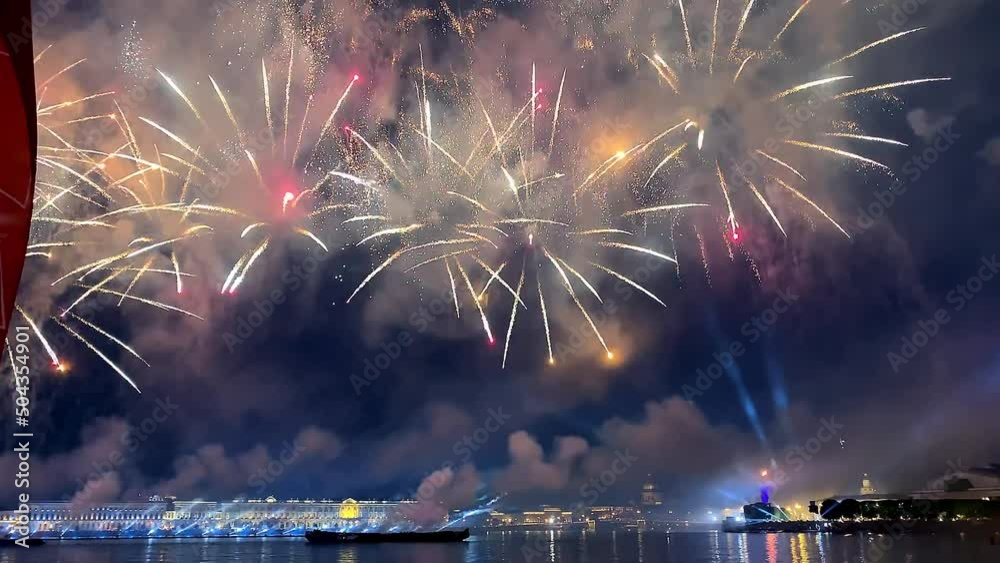 4 July Fireworks Festival. Explosions fireworks of the night sky over the river. Darkness and fireworks. Colorful big shiny fireworks in the glowing show. 4th independence day or new year.