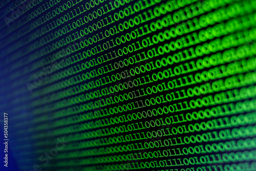 Binary Code Background. Technology abstract green background, green binary code on computer screen texture background. An image of a binary code made up of a set of green digits on a black background