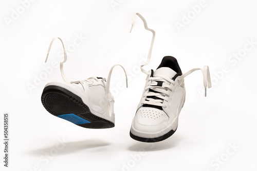 New unbranded tennis shoes on white background with clipping path included. New unbranded Sneakers or trainers on white background. Men's sport footwear. Pair of sport shoes.