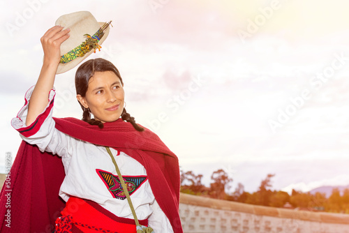 Peasant woman with Latin features taking off her hat from her head