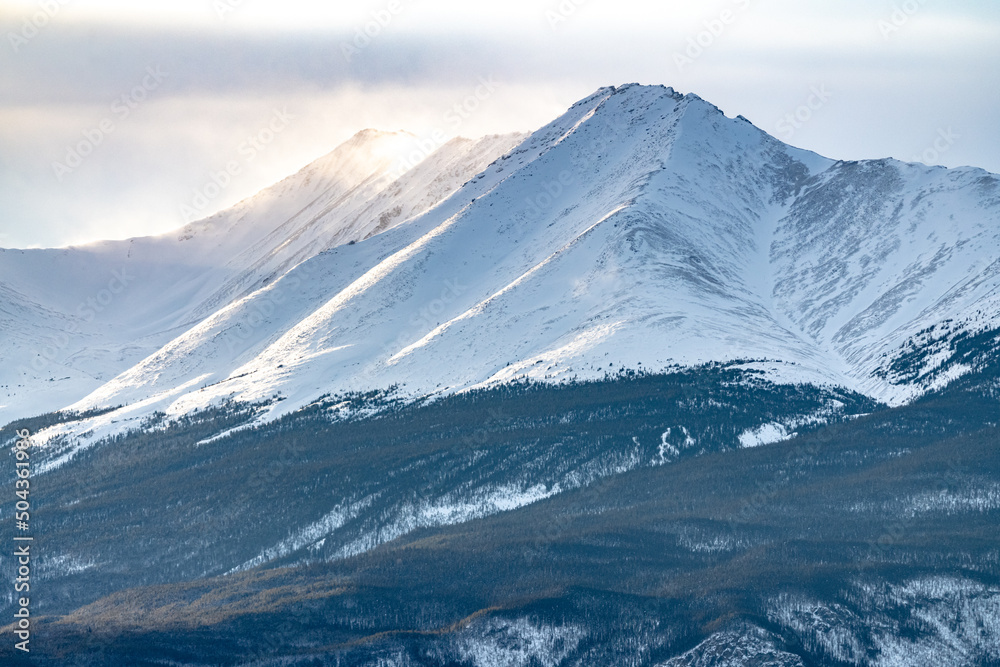 Snow capped mountains in Canada during winter. Snow capped mountains in Canada during winter.