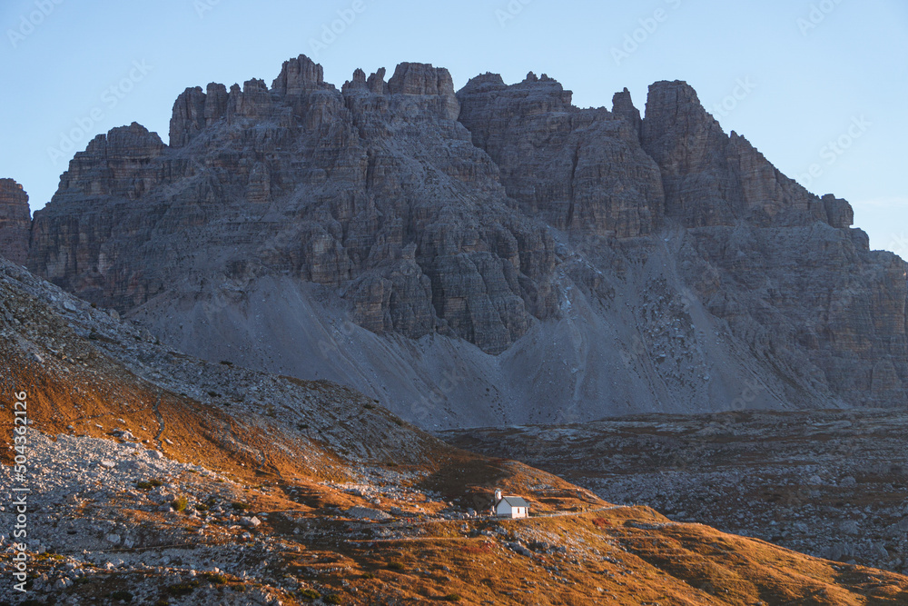 the mountains during sunrise in the natural park Tre Cime - Sesto Dolomites, near the town of Cortina d'ampezzo, Veneto, Italy - October 2021. the mountains during sunrise in the natural park Tre Cime - Sesto Dolomites, near the town of Cortina d'ampezzo, Veneto, Italy - October 2021.