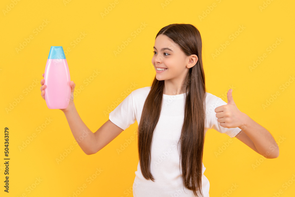 shampooing long hair in salon. child with conditioner. daily habits and personal care. shampooing long hair in salon. child with conditioner. daily habits and personal care.