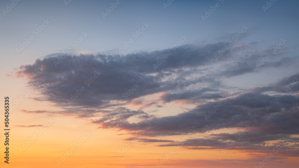 Yellow blue sky with clouds at beautiful sunset as natural background.