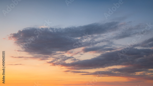 Yellow blue sky with clouds at beautiful sunset as natural background. © rasica
