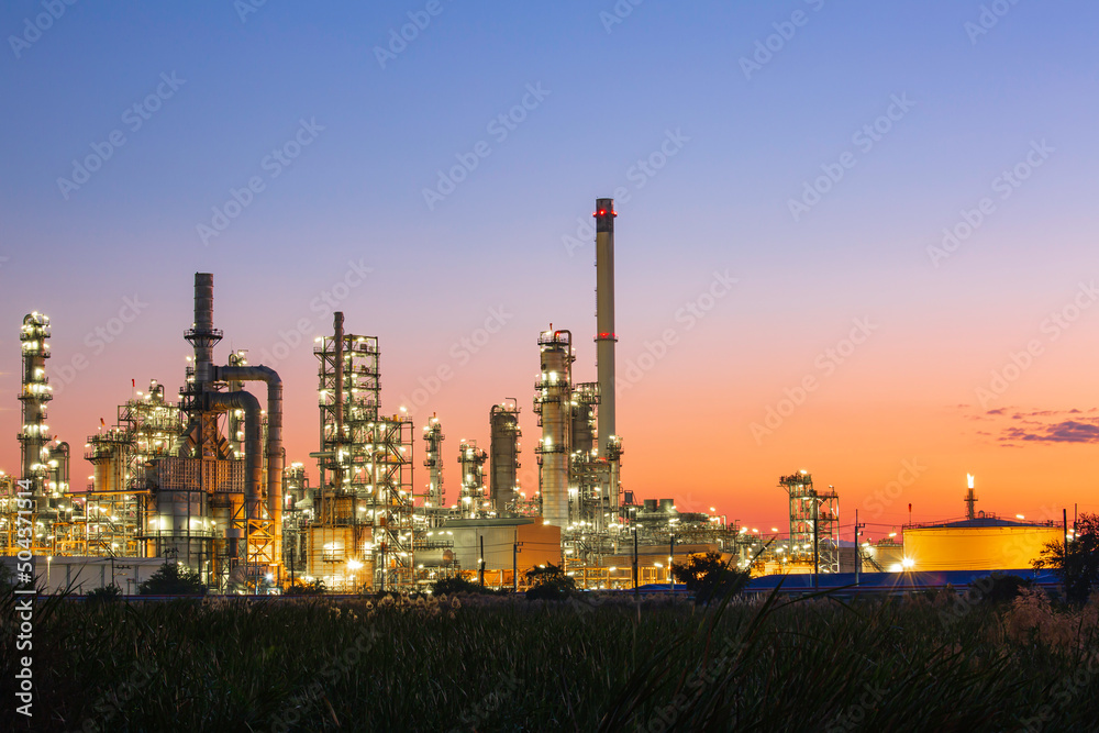 Twilight scene of tank oil refinery plant and tower column of Petrochemistry