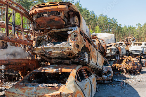 Many shot and destroyed cars at the car graveyard in Irpin, Ukraine.