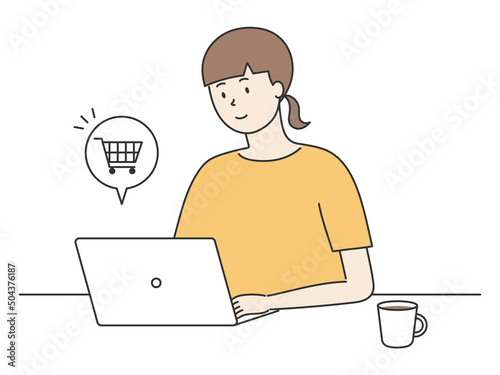 ノートパソコンでネットショッピングをする女性