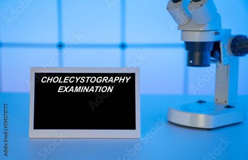 Medical tests and diagnostic procedures concept. Text on display in lab Cholecystography Examination photo