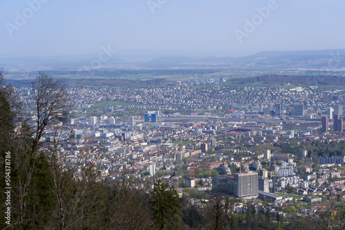 Panoramic view from local mountain Uetliberg over City of Zürich on a blue cloudy spring day. Photo taken April 14th, 2022, Zurich, Switzerland.