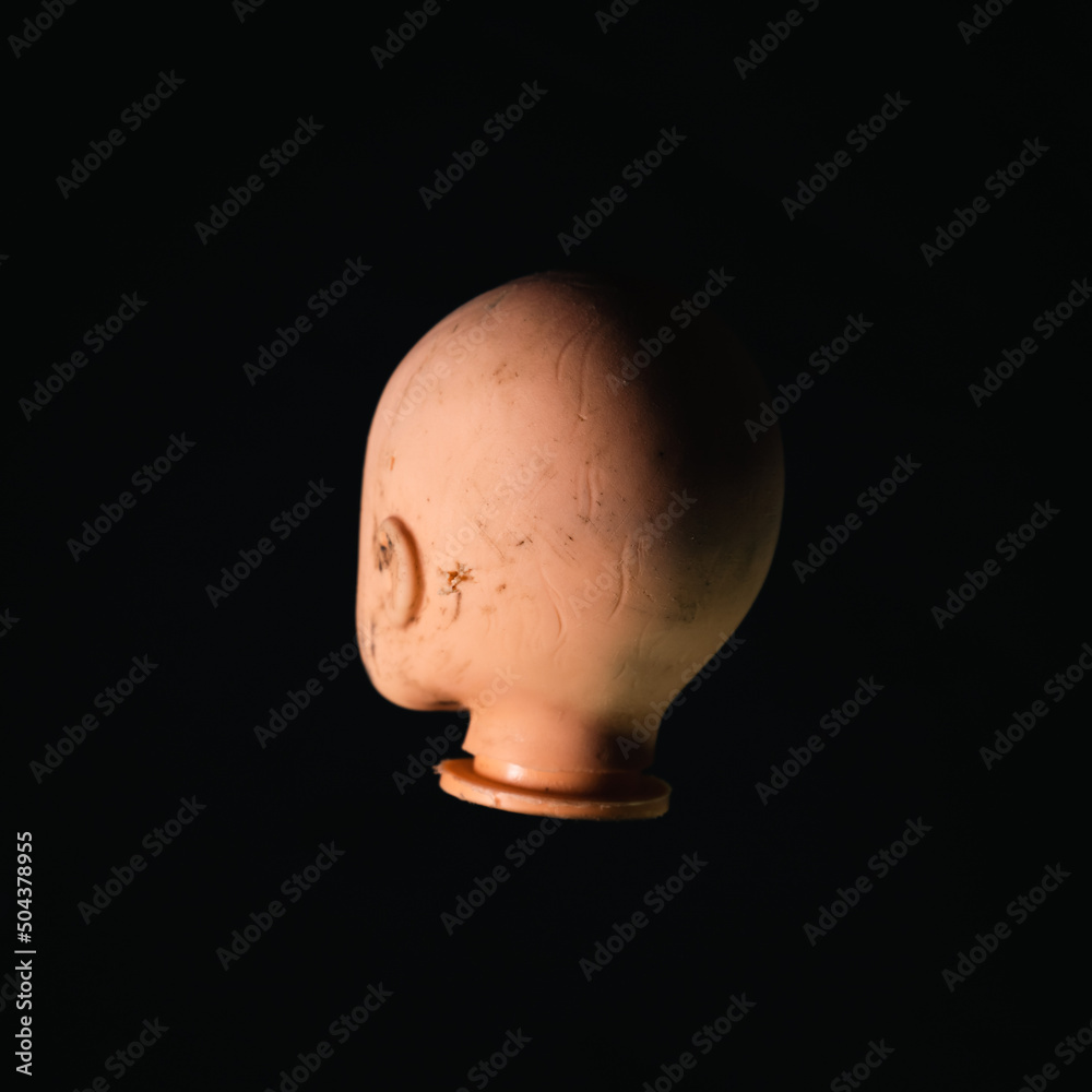 Damaged Dirty Doll head on black background Damaged Dirty Doll head on black background
