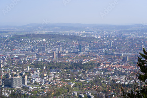 Panoramic view from local mountain Uetliberg over City of Zürich on a blue cloudy spring day. Photo taken April 14th, 2022, Zurich, Switzerland.