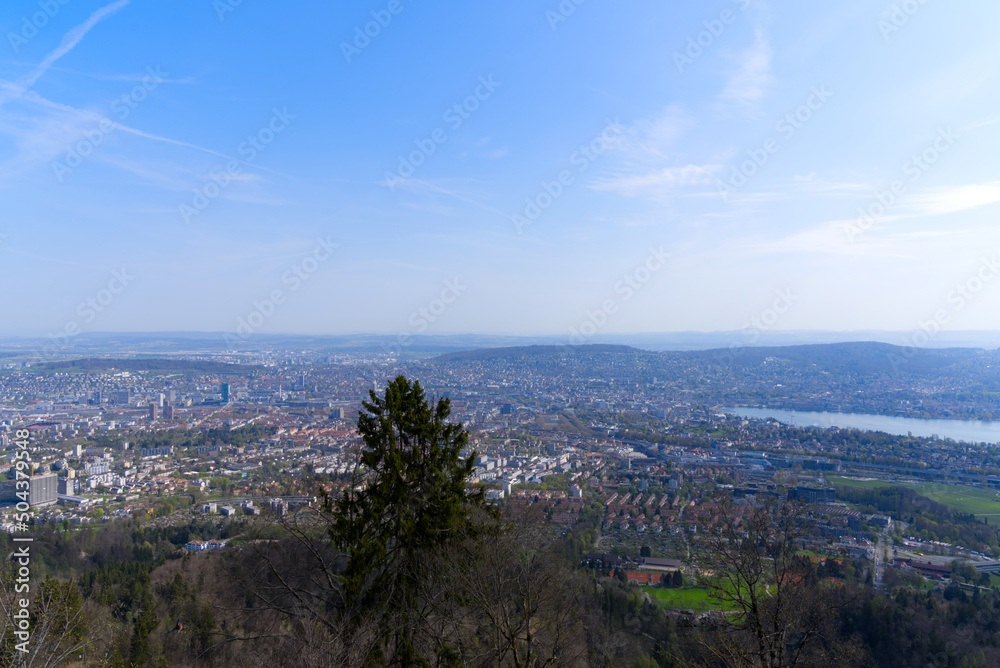 Panoramic view over City of Zurich with lake Zurich seen from local mountain Uetliberg on a summer day morning. Photo taken April 14th, 2022, Zurich, Switzerland.