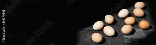 Eggs on dark background. Minimal Easter concept idea.