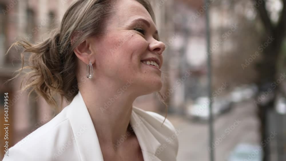 an attractive romantic woman in white clothes against the background of the city an attractive romantic woman in white clothes against the background of the city
