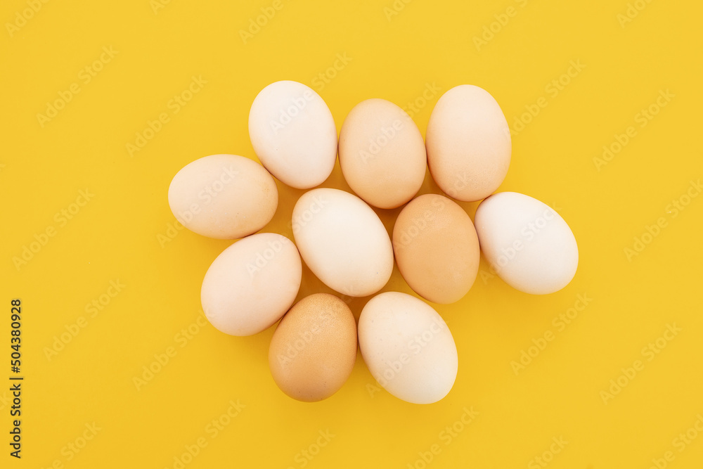 Eggs on the yellow background.