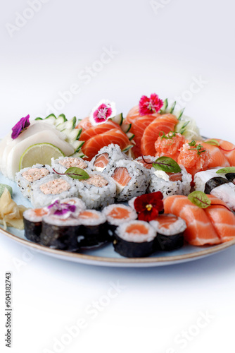 baked hot sushi rolls on a dark background. Hot fried Sushi Roll Sushi menu Set of sushi food with copy space Set of sushi with wasabi, soy sauce and teapot on black stone background