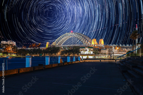 Star trails in the sky over Sydney Harbour NSW Australia startrails. lovely patterns and beautiful colours of the night.