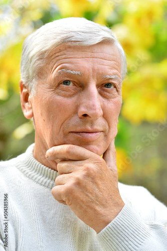 Close up portrait of a thoughtful elderly man