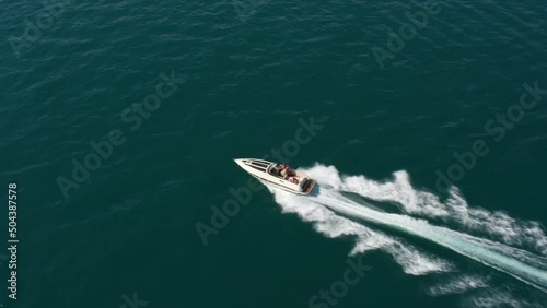 Wallpaper Mural Speedboat moves fast on the water side view. Fast boat movements with people aerial view. Torontodigital.ca