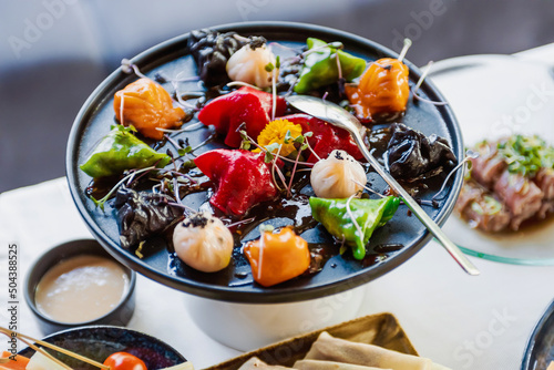 Dish of marinated vegan snacks with filling on the banquet table. Shallow depth of field.