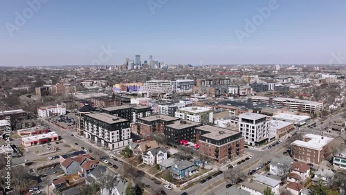 rotating aerial drone shot of uptown minneapolis with downtown minneapolis in the background photo