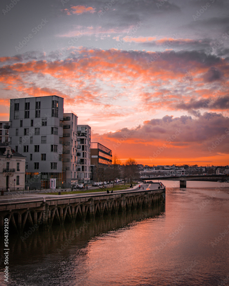 Naklejka premium sunset over the river
