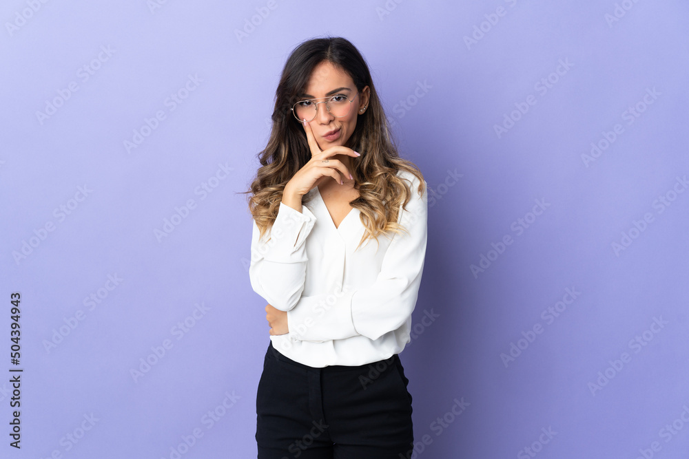 Young caucasian woman isolated on purple background and thinking Young caucasian woman isolated on purple background and thinking