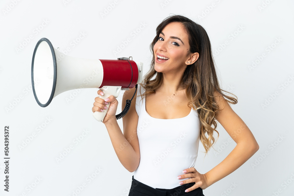 Young caucasian woman isolated on white background holding a megaphone and smiling Young caucasian woman isolated on white background holding a megaphone and smiling