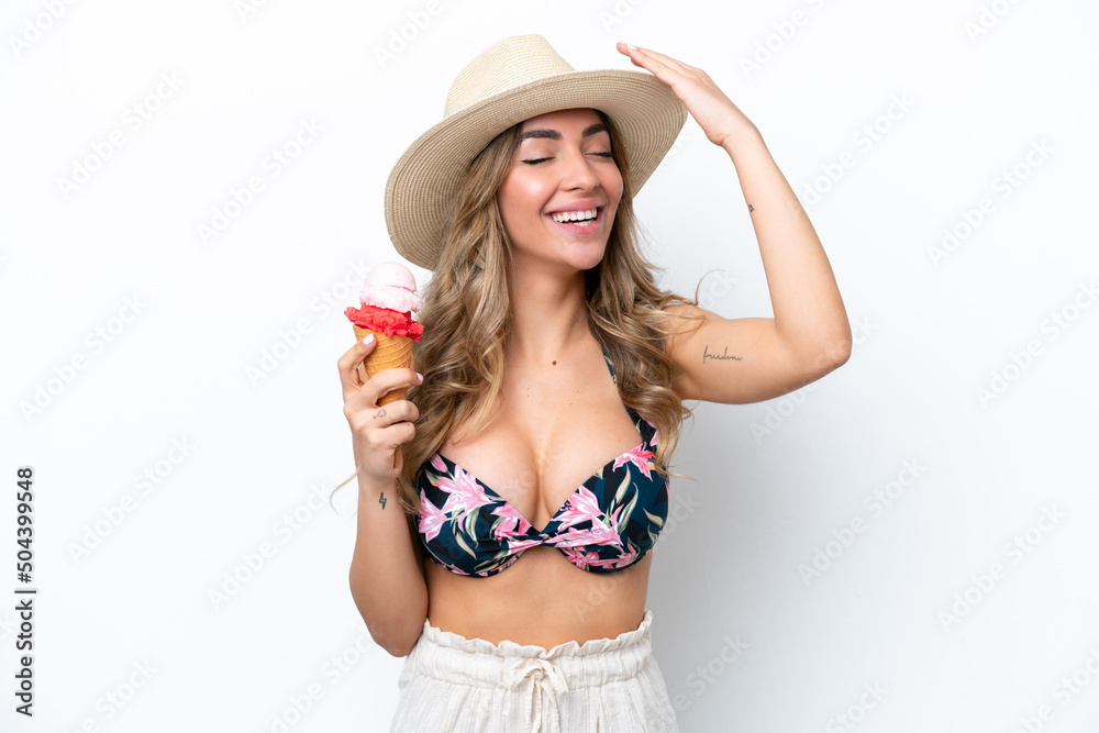 Girl wearing a swimsuit and holding cornet ice cream isolated on white background has realized something and intending the solution Girl wearing a swimsuit and holding cornet ice cream isolated on white background has realized something and intending the solution