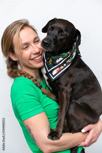 Young caucasian woman with her dog over isolated background