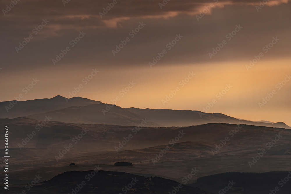 Snowdonia Wales morning landscape view with mist and orange sky