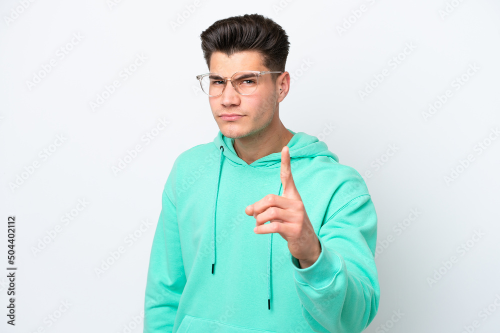 Young handsome caucasian man isolated on white bakcground frustrated and pointing to the front Young handsome caucasian man isolated on white bakcground frustrated and pointing to the front