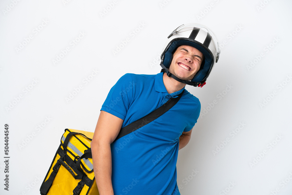 Young caucasian man with thermal backpack isolated on white background suffering from backache for having made an effort Young caucasian man with thermal backpack isolated on white background suffering from backache for having made an effort