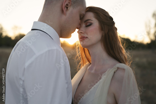 A beautiful couple of newlyweds at sunset