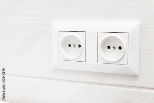 socket on light tiles in the bathroom. close-up