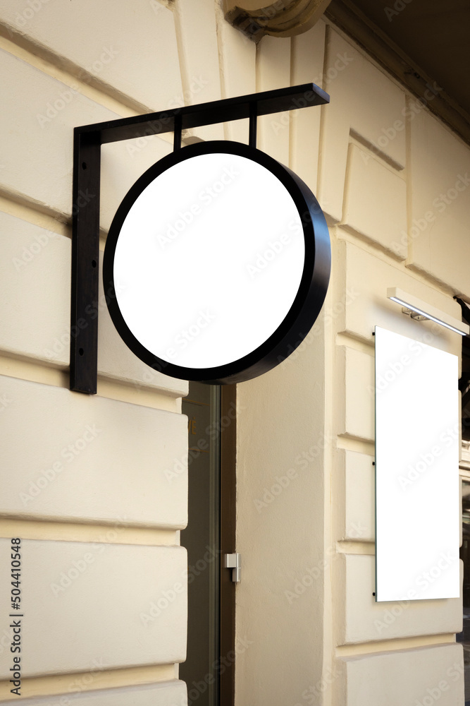 Mock up. Empty white round signage and vertical rectangular