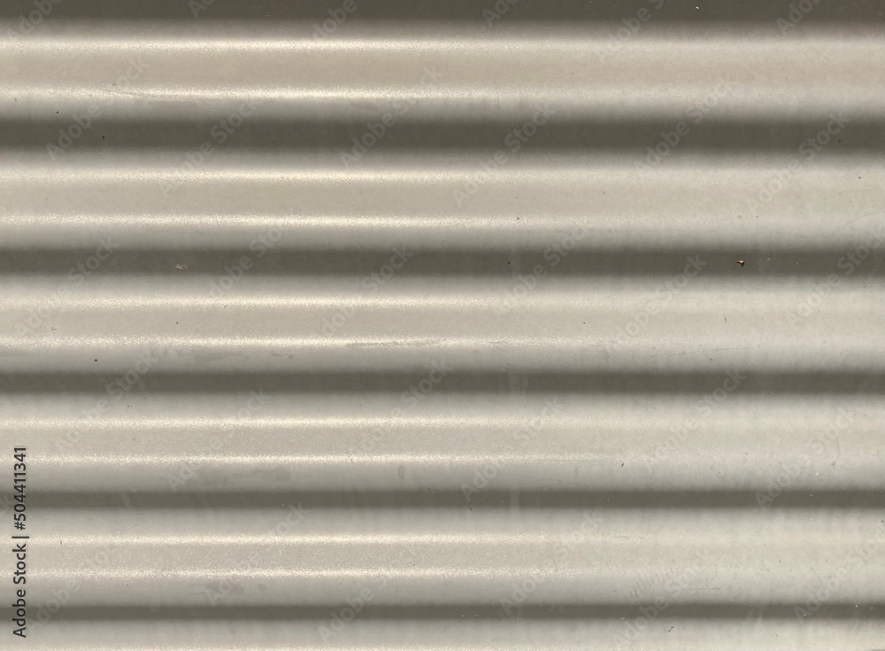 Gray corrugated metal as background