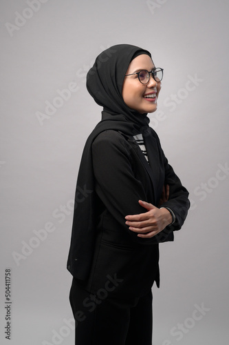 Beautiful muslim woman wearing glasses over white background studio