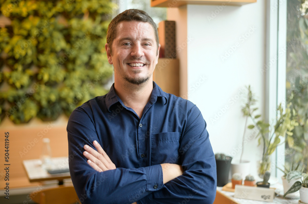 Portrait of business caucasian man in coffee shop