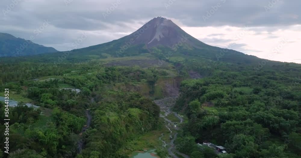 Aerial view of tropical nature landscape with Merapi Volcano in background during cloudy mystic day Aerial view of tropical nature landscape with Merapi Volcano in background during cloudy mystic day