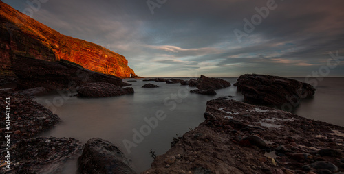 Sunset and Sea Arch at Auchmithie Beach, Angus, Scotland