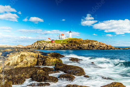 The Nubble Point lighthouse on Cape Neddick, Maine photo