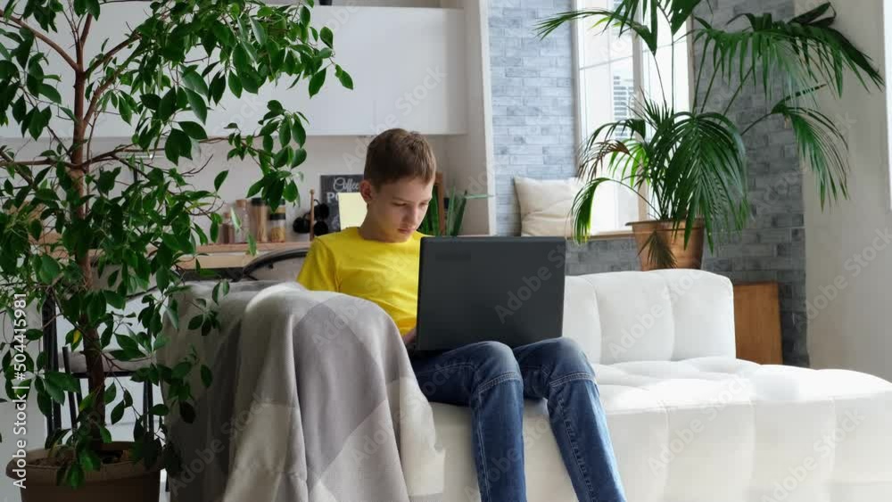Boy teenager doing homework at home. Back to school, online learning and education at home. Slow motion Boy teenager doing homework at home. Back to school, online learning and education at home. Slow motion