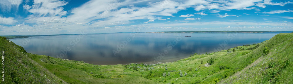 Sunny view on panorama of the Volga river. landscape with green hills and a river