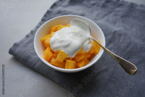 Ripe mango with homemade yogurt