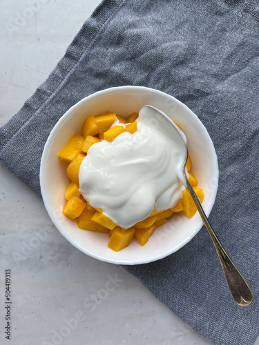 Ripe mango with homemade yogurt