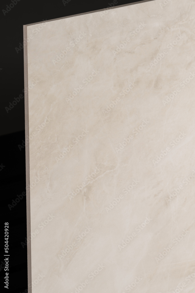 Porcelain tiles with a stone texture on a dark gray background Porcelain tiles with a stone texture on a dark gray background