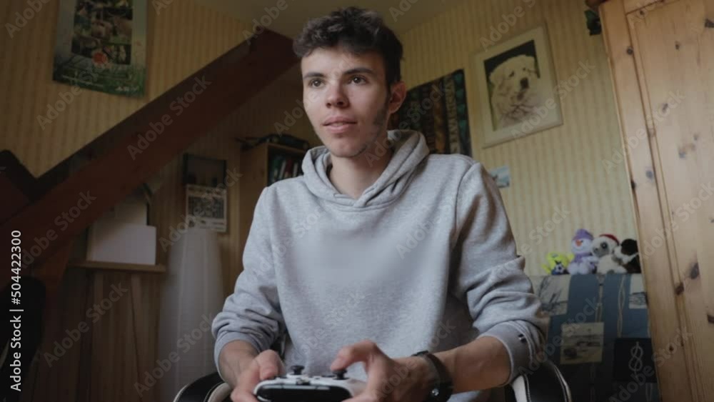 Unshaven young man playing video games and winning - Slow motion Unshaven young man playing video games and winning - Slow motion