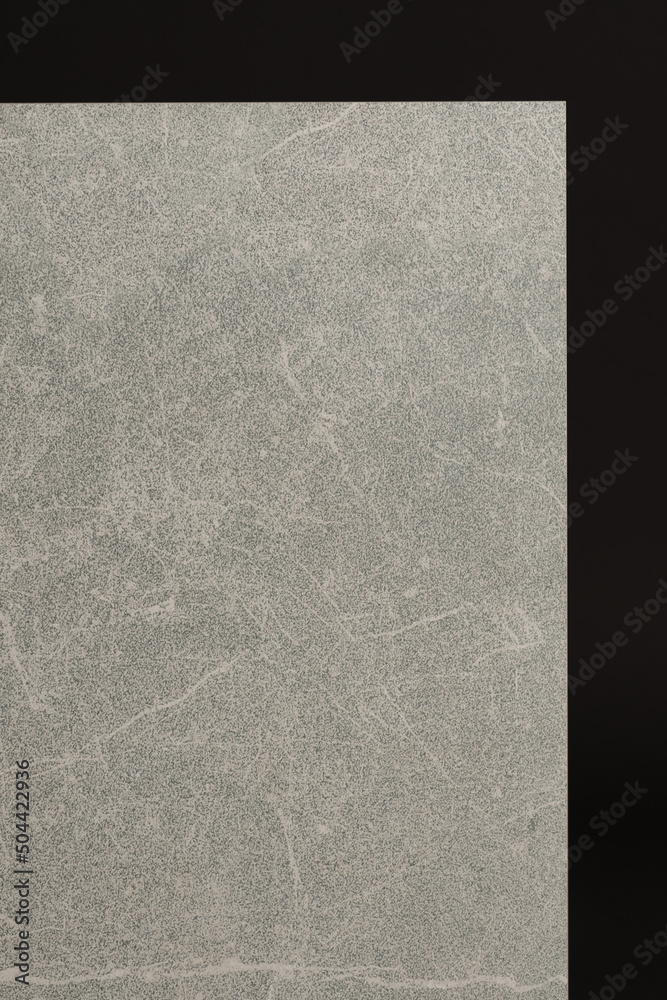 Fototapeta premium Porcelain tiles with a stone texture on a dark gray background